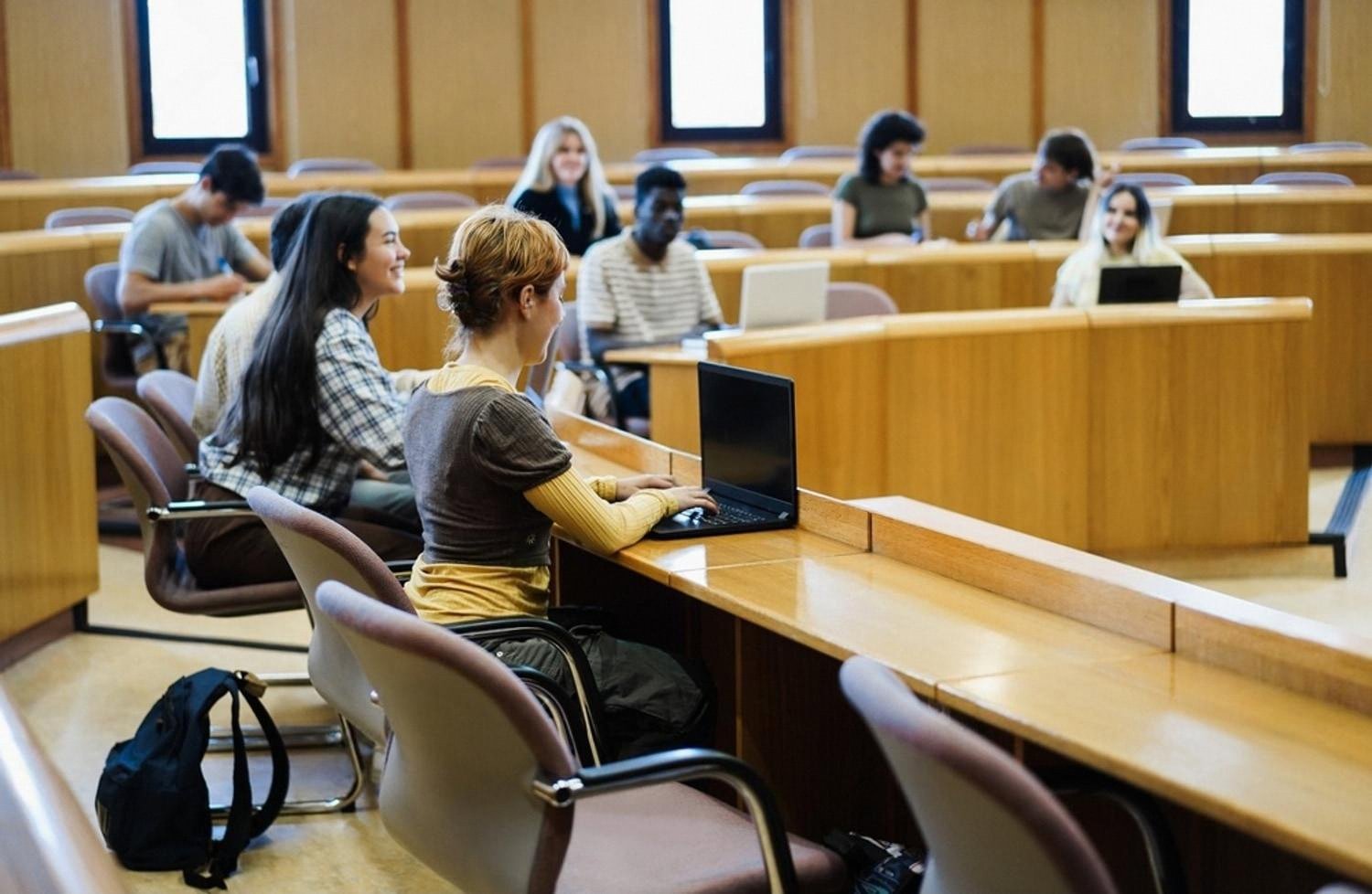 Students studying in a tiered lecture hall on a BTEC programme in the UAE